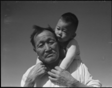 Manzanar Relocation Center, Manzanar, California. Grandfather and grandson of Japanese ancestry at this War Relocation Authority center. (Photo by Dorothea Lange).